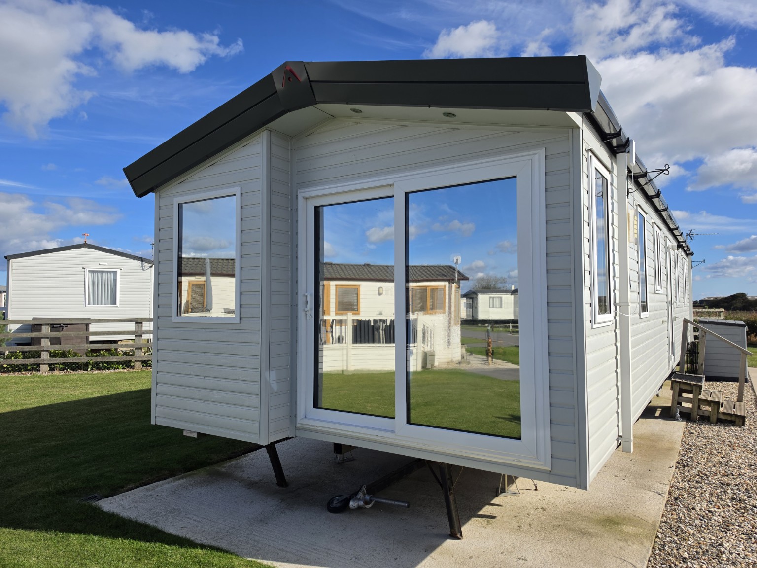 Holiday lodge with glazed front doors and windows